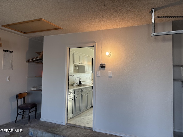 2149 Octubre Dr, El Paso, TX 79935 - hallway featuring a sink and electric panel