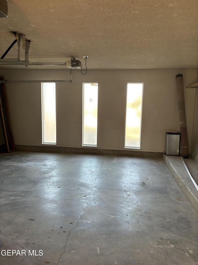2149 Octubre Dr, El Paso, TX 79935 - garage featuring a garage door opener