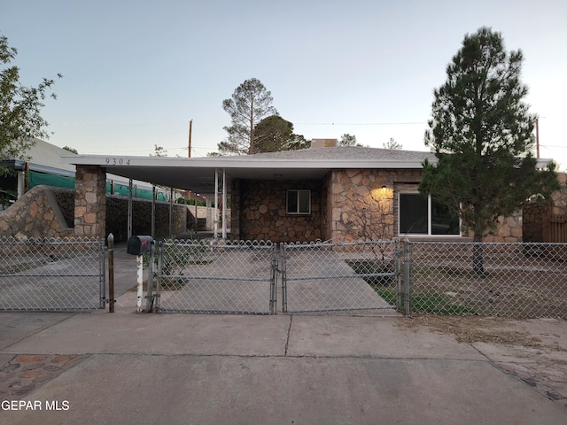 view of front of home with a carport