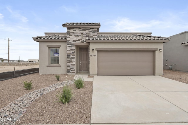 mediterranean / spanish-style home featuring a garage