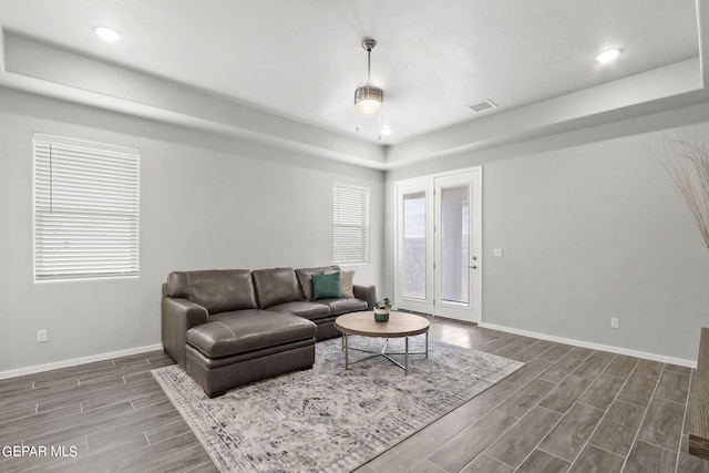 living room with dark hardwood / wood-style flooring