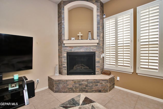 tiled living room featuring a fireplace