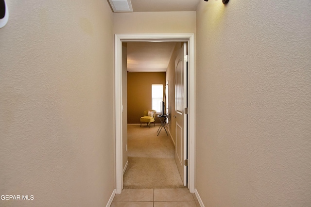 hall with light tile patterned flooring