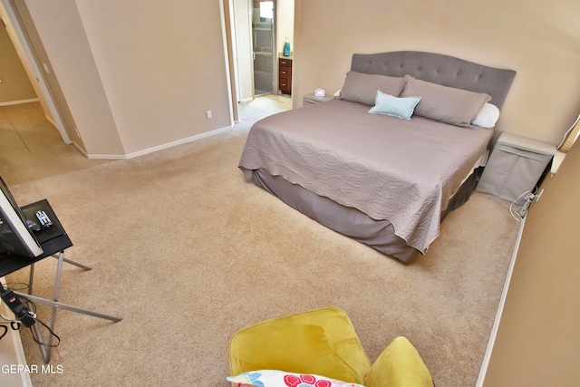 carpeted bedroom with ensuite bathroom