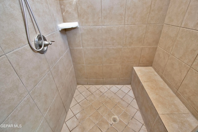 bathroom with tiled shower