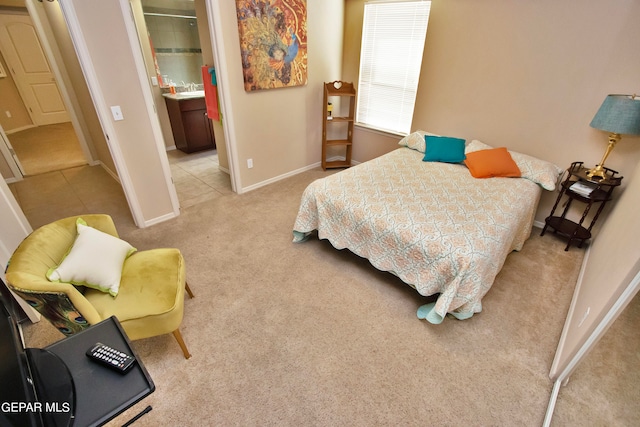 bedroom featuring light carpet