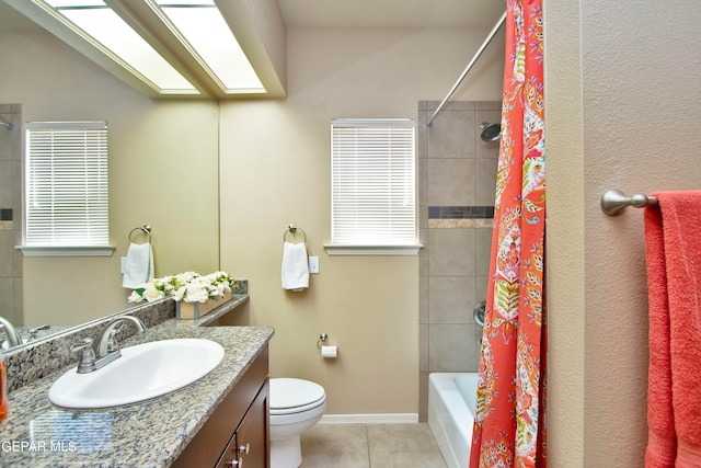 full bathroom featuring tile patterned floors, vanity, shower / bath combination with curtain, and toilet