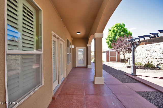 view of patio / terrace featuring a storage unit