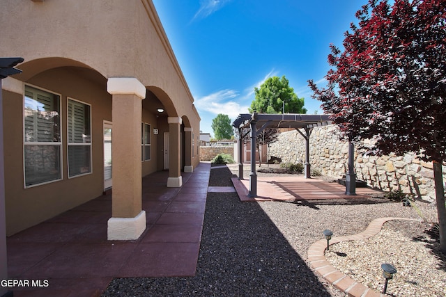 view of patio featuring a pergola