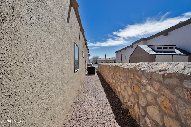 view of home's exterior with cooling unit