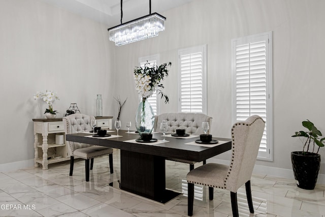 dining space with a chandelier