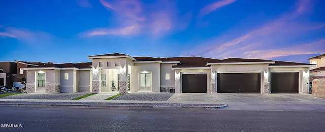 prairie-style home featuring a garage