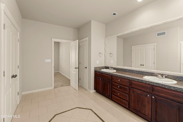 bathroom featuring vanity and tile patterned flooring