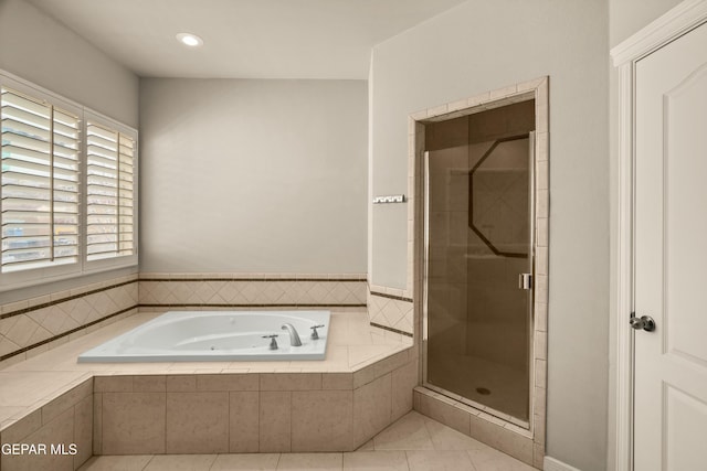 bathroom featuring tile patterned floors and plus walk in shower