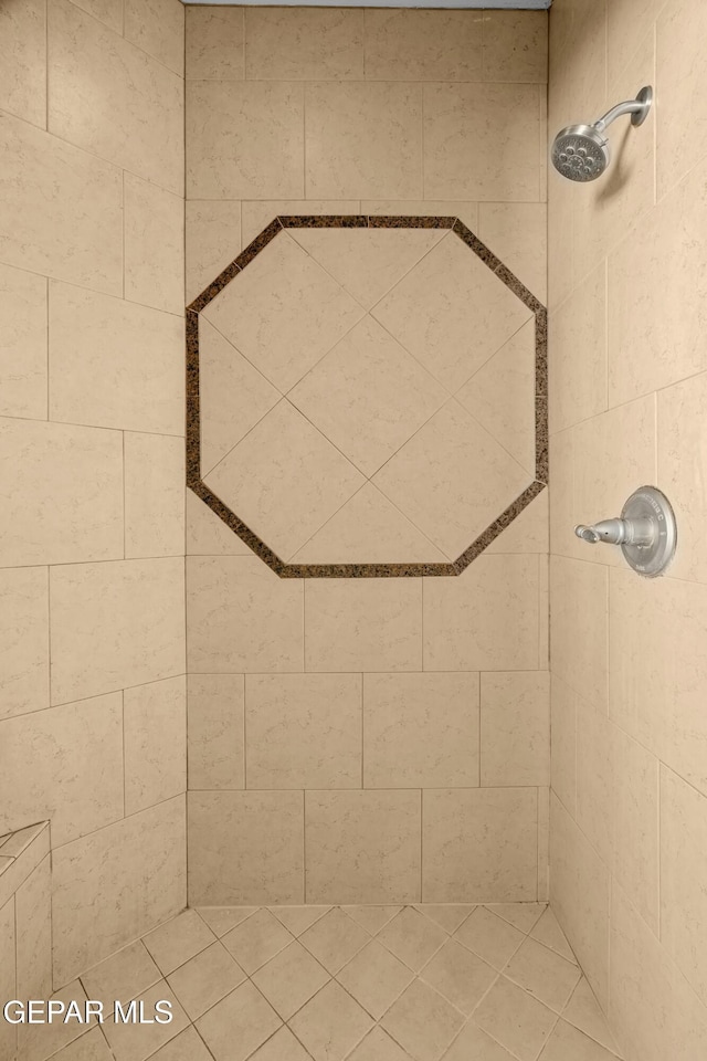 details featuring a tile shower