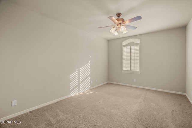 unfurnished room with carpet and ceiling fan