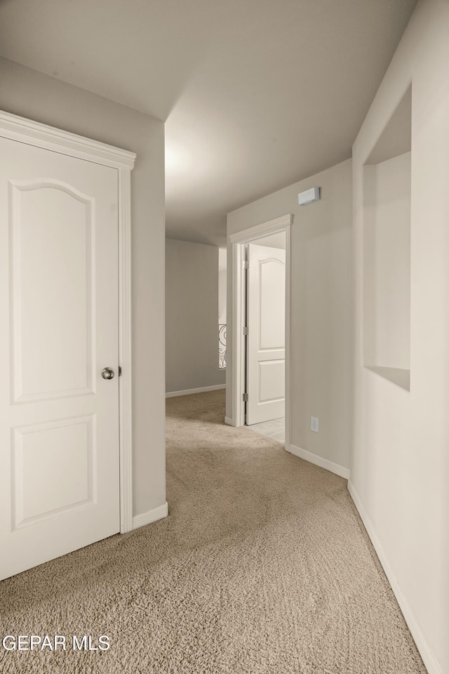 spare room with light colored carpet