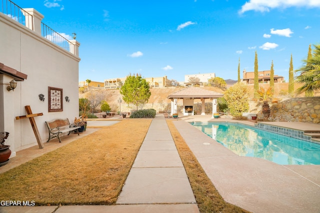 view of pool with a patio and a gazebo