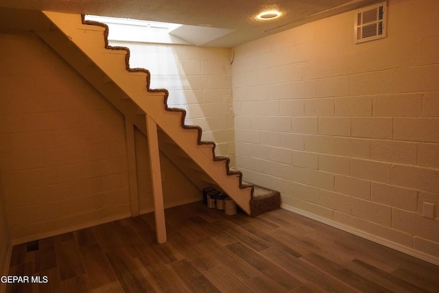 2406 Lebanon Rear, Rear, El Paso, TX 79930 - finished basement featuring dark wood-style flooring, stairs, and baseboards