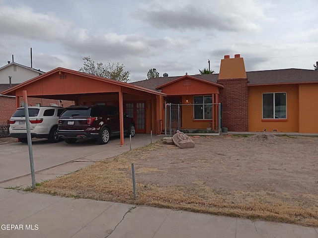 view of front of house featuring a carport