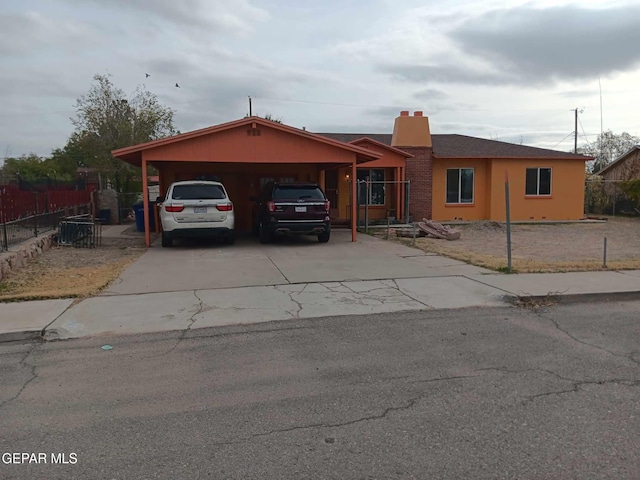 single story home with a carport