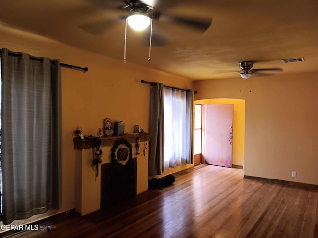 empty room featuring ceiling fan and wood-type flooring