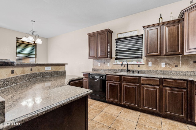 kitchen with dishwasher, backsplash, a chandelier, and sink