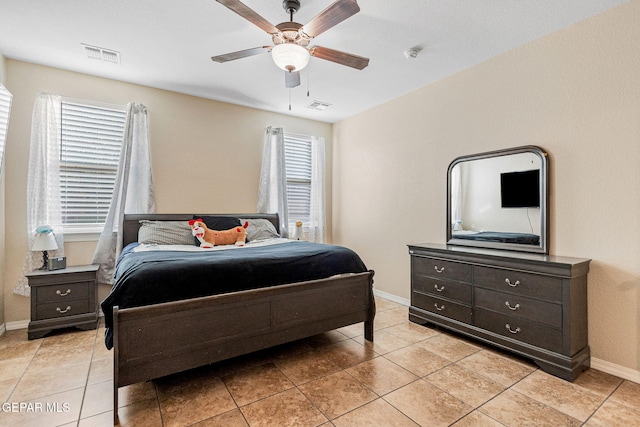 tiled bedroom with ceiling fan