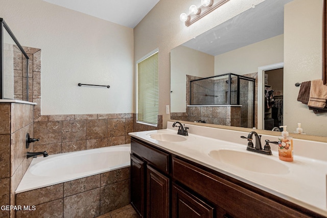 bathroom featuring separate shower and tub and vanity