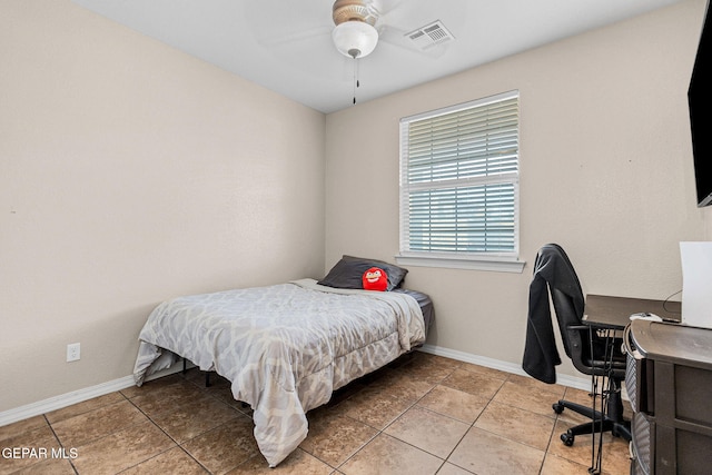 bedroom with tile patterned flooring and ceiling fan