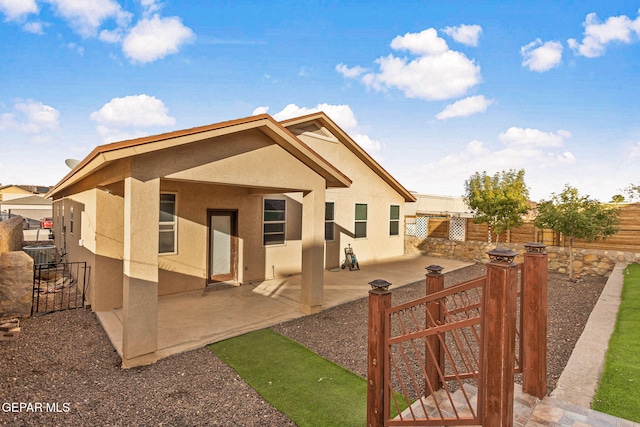 back of property featuring a patio area