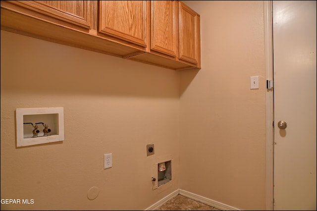 clothes washing area featuring hookup for a gas dryer, hookup for a washing machine, cabinets, and hookup for an electric dryer