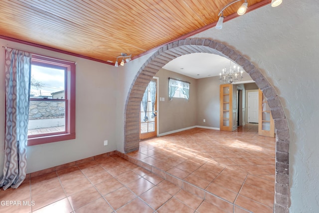 interior space with light tile patterned floors, wooden ceiling, and an inviting chandelier