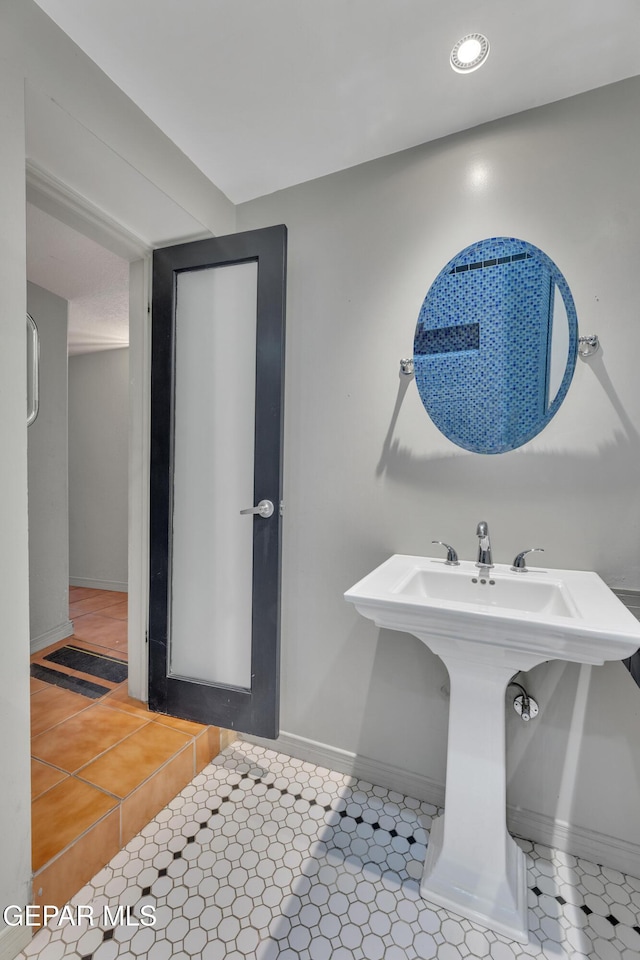 bathroom featuring tile patterned floors and sink