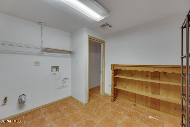 laundry room featuring gas dryer hookup, hookup for a washing machine, and tile patterned flooring