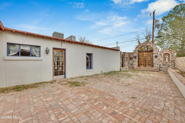 view of home's exterior featuring a patio and central AC unit