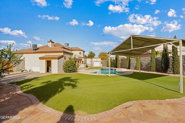 view of yard with a gazebo, a patio, a fenced in pool, and central AC