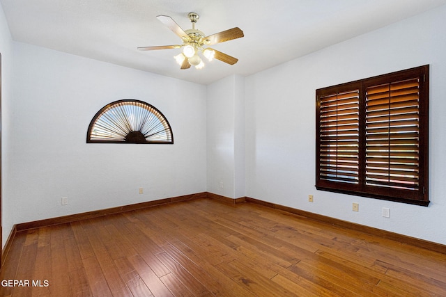 unfurnished room featuring ceiling fan and wood-type flooring