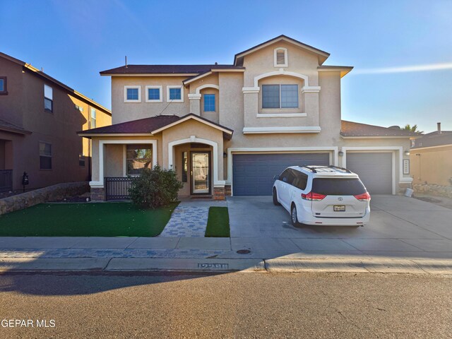12298 Stansbury Dr, El Paso, TX 79928 - view of front of home featuring a front lawn and a garage