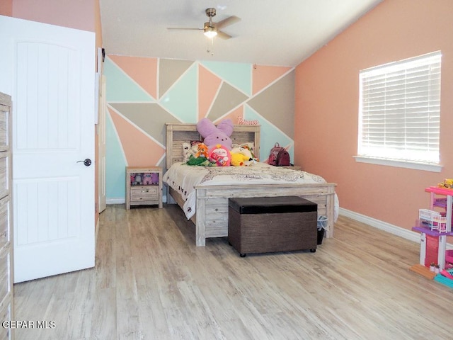 bedroom with ceiling fan and light wood-type flooring