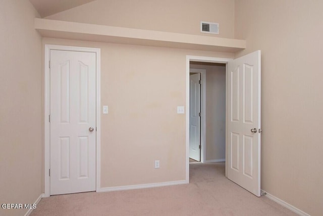 unfurnished bedroom with light carpet