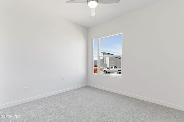 empty room with carpet floors and ceiling fan