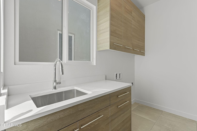 interior space featuring light tile patterned floors and sink