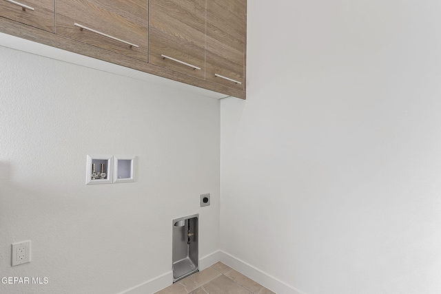 laundry area with washer hookup, light tile patterned floors, cabinets, and hookup for an electric dryer