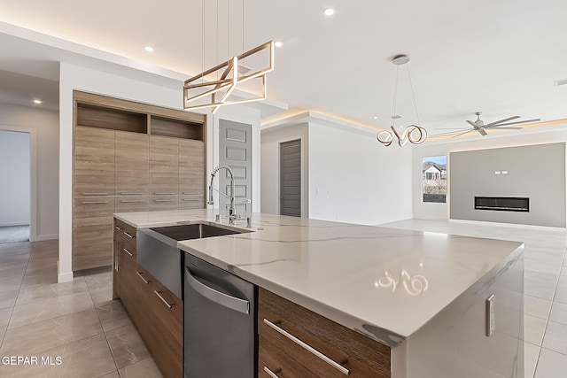 kitchen featuring dishwasher, ceiling fan with notable chandelier, hanging light fixtures, and a large island