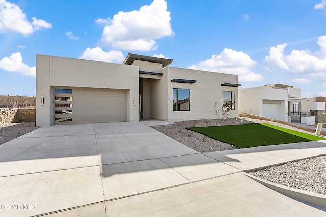 view of front facade with a front yard and a garage