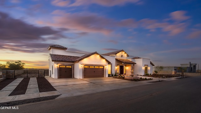 mediterranean / spanish-style home featuring a garage