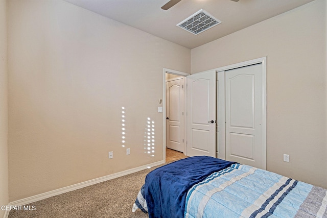 bedroom featuring light carpet, a closet, and ceiling fan