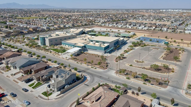 birds eye view of property featuring a mountain view