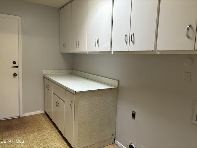 laundry room featuring cabinets and hookup for an electric dryer